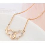 Ineinander verschlungene Doppelherz-Halskette, funkelndes Gold