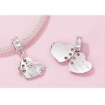 Ezüst charm, szív masnival