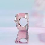 Ezüst charm, szív masnival