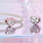 Ezüst charm, szív masnival