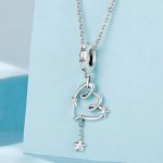 Ezüst charm, szív csillaggal