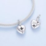 Ezüst charm, szív csillaggal