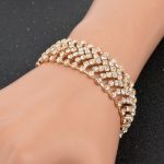  Vergoldetes Armband mit Kristallen, goldfarben, 17+6 cm