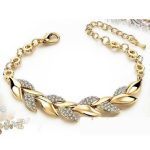  Armband mit Blättern, verziert mit Kristallen, in Goldfarbe