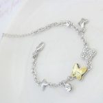  Schmetterlingsarmband, gelblich-weiß, verziert mit Swarovski-Kristallen