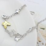  Schmetterlingsarmband, gelblich-weiß, verziert mit Swarovski-Kristallen
