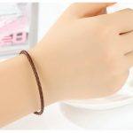 Geflochtenes Armband, Leder, braun, mit Silberverschluss, 20 cm