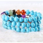  Meditationsarmband mit Buddhakopf und türkisfarbenen Perlen