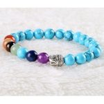 Meditationsarmband mit Buddhakopf und türkisfarbenen Perlen