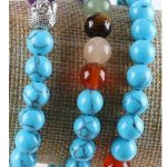  Meditationsarmband mit Buddhakopf und türkisfarbenen Perlen