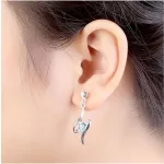 Spiralförmige Herzohrringe, verziert mit Swarovski-Kristallen und Peridot