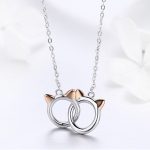 Silberne Halskette mit doppeltem Katzenkopf