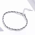 Ezüst karkötő zsinórral, fekete