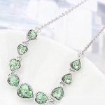  Herzförmiges Schmuckset, Peridotgrün, verziert mit Swarovski-Kristallen