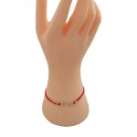 Uhrenarmband aus 14-karätigem Gold mit kristallverziertem Unendlichkeitsanhänger