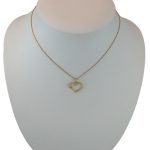 Anhänger aus 14-karätigem Gold, Kristallherz, mit vierblättrigem Kleeblatt