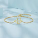 Ezüst karkötő macskával, aranyszínben