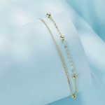 Ezüst karkötő dupla lánccal aranyszínben