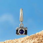 Ezüstcharm, fényképezőgép